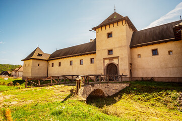 Gothic-Renaissance mansion water castle near the Wooden Protestant Articular Church in Hronsek,...