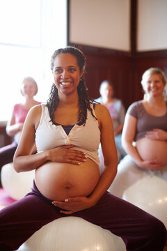 Pregnant, Mother And People At Pregnancy Yoga Class, Doing Pilates For Fitness And Workout For Healthy Body. Happy Women Doing Calm And Peaceful Sports Training For Wellbeing And Health At Gym