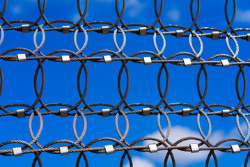 Fototapeta premium Close-up of protection metal grid net on a sunny summer day. Photo taken July 10th, 2022, Unterstammheim, Switzerland.