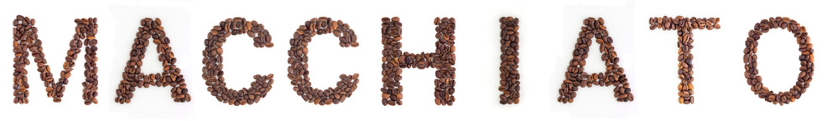 MACCHIATO text from roasted coffee beans on white background