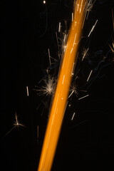 orange flame with sparks on a black background