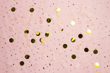 Pink background with gold glitter with copy space.