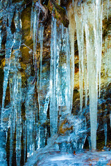 Fototapeta premium Ice formations including icicles and subtle colors in Bolton, Connecticut.
