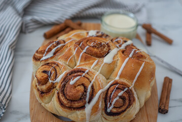 Beautiful fresh cinnamon rolls on wooden table