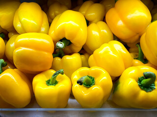 Colorful of sweet bell peppers in the basket at the supermarket
