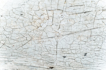 white color crack on old wood surface pattern for background. cracked wooden board painting texture.