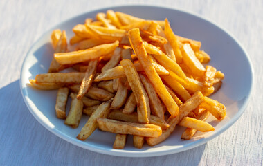 fried french fries on a white plate