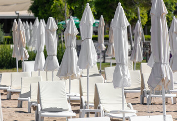 Sunbeds with sun loungers on the beach