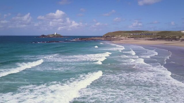 Foamy Sea Waves Splashing On The Shore Of Godrevy Beach In Cornwall, England - aerial drone shot
