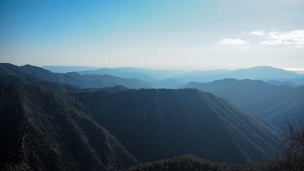 high mountain peaks in blue sky