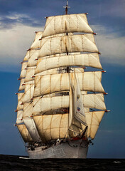 A walking ship with stunning developing sails, breaking the waves.  © Irina Pchelkina