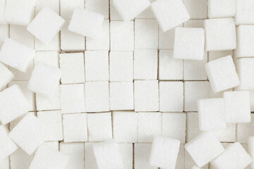 White sugar cubes background. Top view.