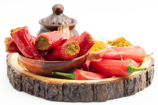 Traditional Homemade Red Chilli Pickle Also Known As Moti Teekhi Lal Mirch Ka Bharwa Bharua Achar Stuffed With Coarsely Powdered Masala Spices Like Seeds Mustard, Fenugreek, Turmeric, Amchur And Hing