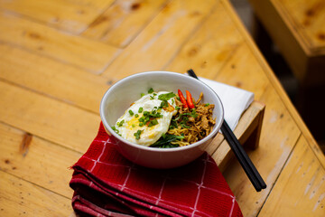Fried noodles with fried egg and red chili