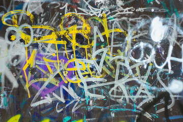 
Abstract background on the wall with chaotic letters.