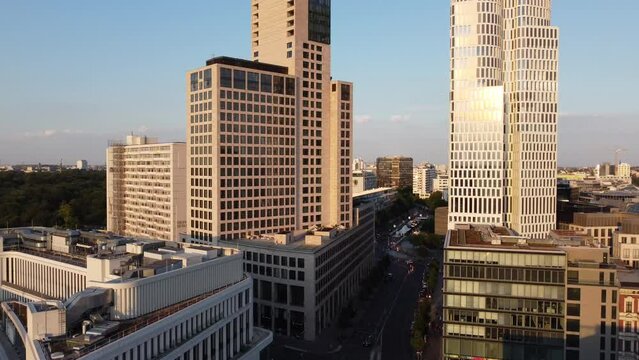 The sun is reflected in the windows of the skyscraper.
Breathtaking aerial view flight panorama orbit drone footage
at Charlottenburg sunny Summer Evening 2022. P. Marnitz 4k Cinematic view from above
