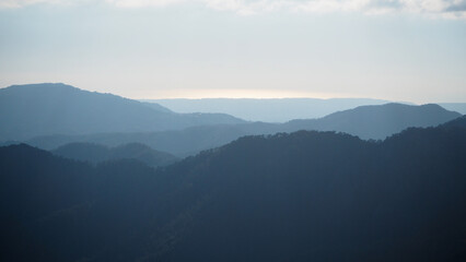 very high mountain peaks in blue sky
