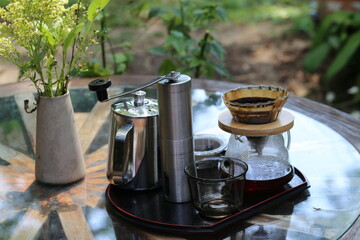 Drip coffee set on the table and blurred background.