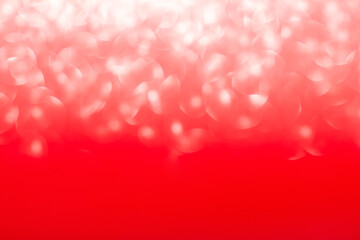 Fototapeta premium Red blurred abstract background with defocus light. With bokeh effect. Christmas, New Year, Valentine's and International Women's Day, Birthday, March 8. Copy space