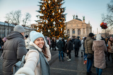 follow me concept woman pulling man to christmas tree