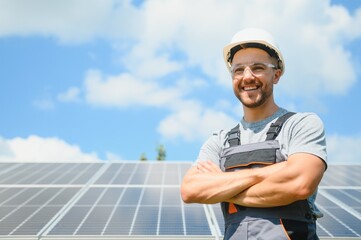 A man working at solar power station.