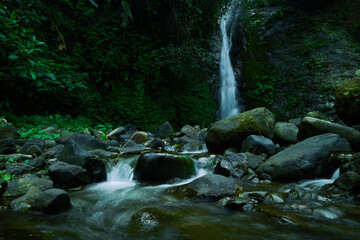 photo of a hidden waterfall, which is in Indonesia, a waterfall with a small water discharge