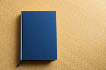 本が一冊青い表紙写真素材