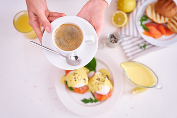Eggs Benedict with Cream cheese and Smoked salmon on a plate