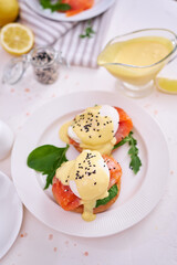 Eggs Benedict with Cream cheese and Smoked salmon on a plate