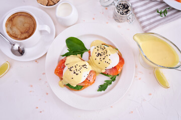 Eggs Benedict with Cream cheese and Smoked salmon on a plate
