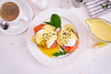 Eggs Benedict with Cream cheese and Smoked salmon on a plate