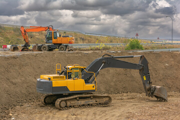 Excavator building a road in a site constructionGroup of excavator working on a construction siteGroup of excavator working on a construction site © Enrique del Barrio