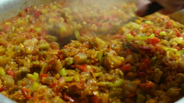 Cooking vegetable stew.  Closeup of mixing vegetable dish, letcho.