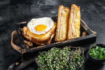 French toasts croque monsieur and croque madame with sliced ham, melted emmental cheese and egg....