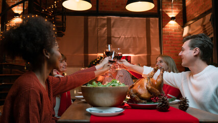 Family toasting on video call with near and dear ones on occasion of Christmas celebration
