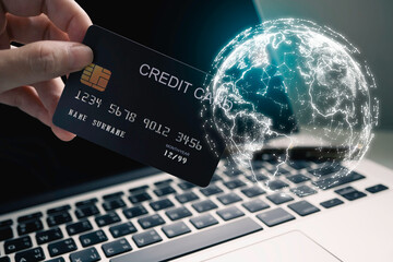 Hand holding credit card and laptop virtual global internet world connection of metaverse...