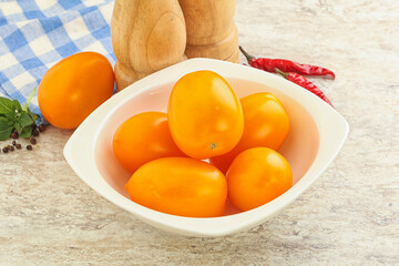 Sweet ripe yellow tomato in the bowl