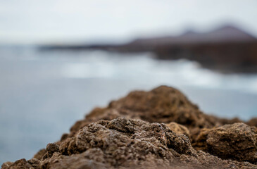 closeup to stone pedestal with coastline background   © Jesus