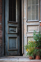 Fototapeta na wymiar Opened old wooden door in antique blue color