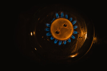 Detail of burning gas on the stove, rising gas prices,detail of a black gas stove, price growth, dirty black oven with a burn gas