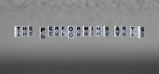 the performing arts word or concept represented by black and white letter cubes on a grey horizon background stretching to infinity