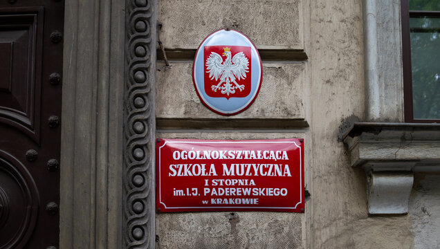 1st degree Music School Ignacy Jan Paderewski in Kraków. Red sign plaque at entrance to the Ogólnokształcąca Szkoła Muzyczna I stopnia im. Ignacego Jana Paderewskiego on May 21, 2022 in Krakow, Poland