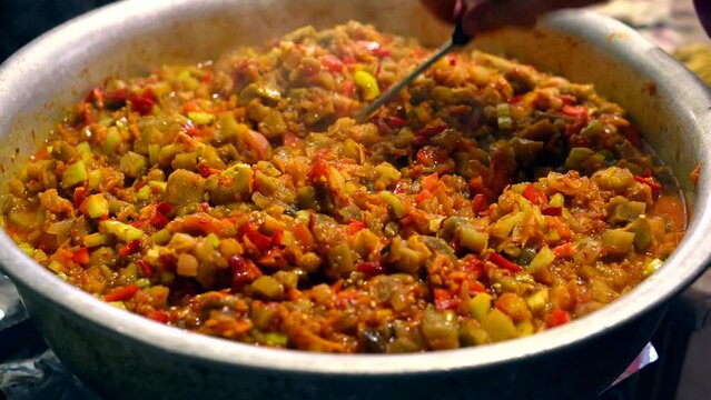 Cooking vegetable stew.  Closeup of mixing vegetable dish. Traditional dish.