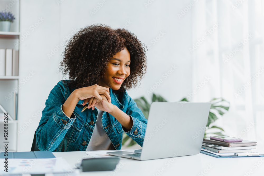 Wall mural Close up portrait beautiful woman smiling and using laptop computer.