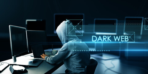 Abstract dark web text over side view of hacker at desk using computers on blurry background....