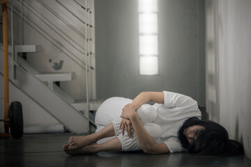 The depressed woman lying down