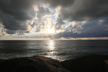 Picturesque view of sky with heavy rainy clouds over sea