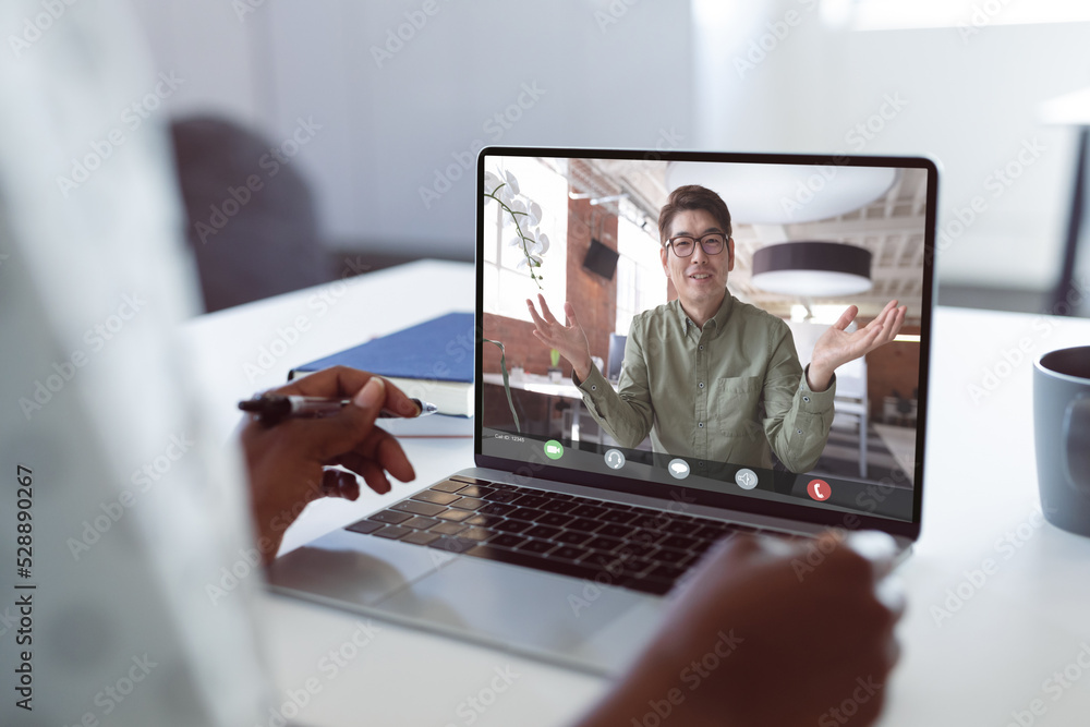 Poster Composition of african american businesswoman having video call with colleague in office