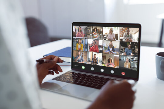 Composition of african american businesswoman having video call with colleagues in office