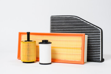 Different car filters for oil and air on a light background. Car repair concept